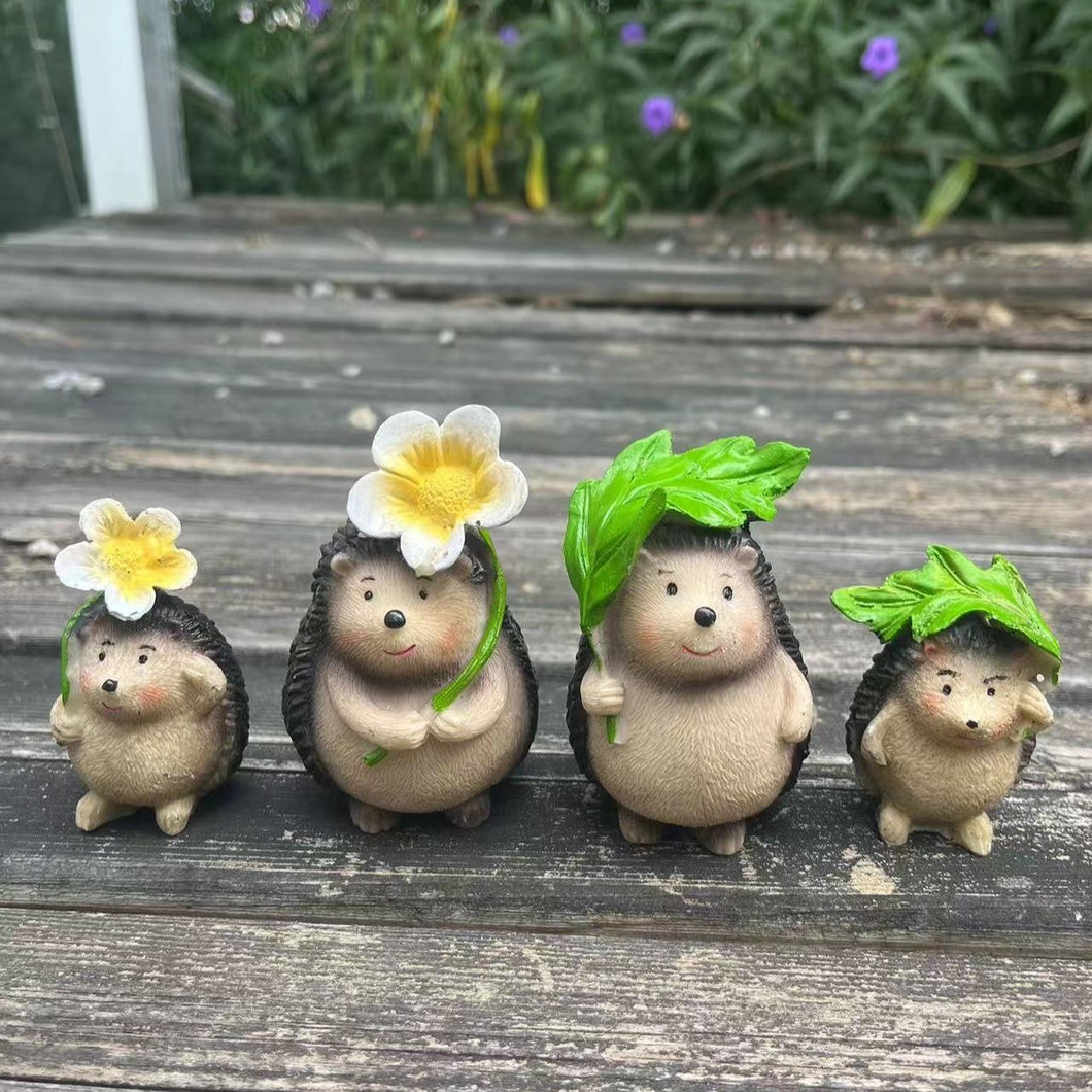 Hedgehog holding flower / leaf garden decorator